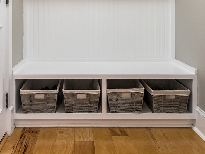 Storage bins in a mudroom